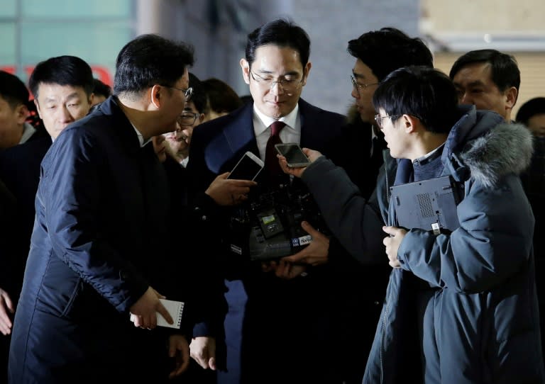 Lee Jae-yong (C), vice chairman of Samsung Electronics, arrives to be questioned as a suspect in a corruption scandal that led to the impeachment of President Park Geun-Hye, in Seoul, on January 12, 2017
