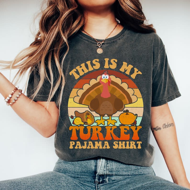 <p><a href="https://go.redirectingat.com?id=74968X1596630&url=https%3A%2F%2Fwww.etsy.com%2Flisting%2F1549823975%2Fthanksgiving-shirt-this-is-my-turkey&sref=https%3A%2F%2Fwww.thepioneerwoman.com%2Fholidays-celebrations%2Fg41461827%2Fthanksgiving-pajamas%2F" rel="nofollow noopener" target="_blank" data-ylk="slk:Shop Now;elm:context_link;itc:0;sec:content-canvas" class="link ">Shop Now</a></p><p>Thanksgiving Shirt, This is my Turkey Pajama Shirt, Thanksgiving, Thankful Fall, Fall Shirt, Thankful Family Shirts, Thankful Autumn</p><p>etsy.com</p><p>$11.16</p><span class="copyright">Etsy</span>