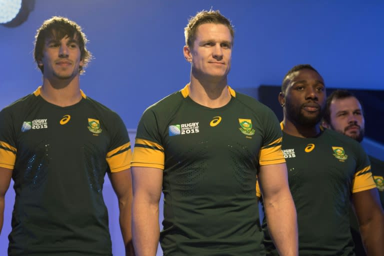 (From L) South African Springboks' Eben Etzebeth, Jean de Villiers and Tendai Mtawarira pose for a photo during the unveiling of the team's new jersey, in Cape Town, on June 4, 2015