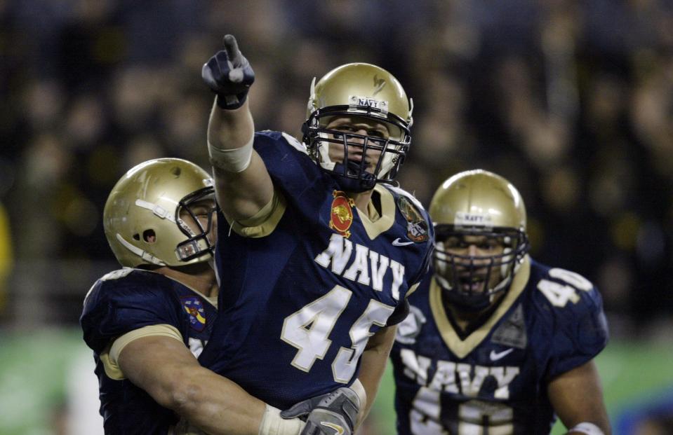 Navy linebacker Tyler Tidwell (45) celebrates a sack in the fourth quarter of a 24-16 win against Army on Dec. 2, 2006, in Philadelphia.