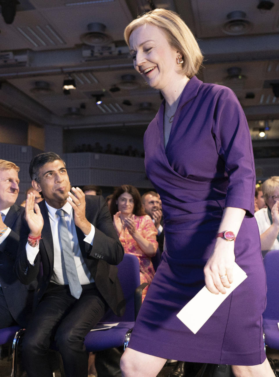 Conservative leadership contender Rishi Sunak, left, applauds as Liz Truss takes to the stage, at the Queen Elizabeth II Centre in London, Monday Sept. 5, 2022. Britain's Conservative Party has chosen Foreign Secretary Liz Truss as the party's new leader, putting her in line to be confirmed as prime minister. Truss's selection was announced Monday in London after a leadership election in which only the 180,000 dues-paying members of the Conservative Party were allowed to vote. (Stefan Rousseau/Pool Photo via AP)