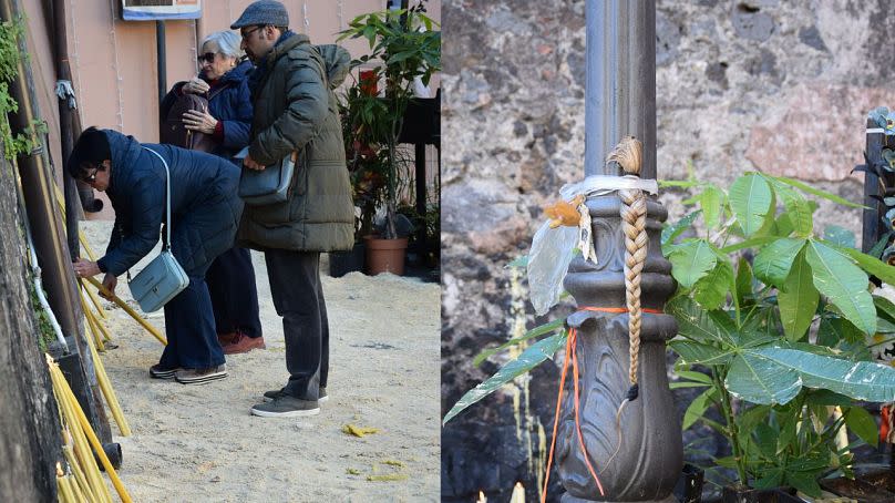 Some followers light candles next to the cell of Saint Agatha and donate hair and other gifts in Catania, Feb. 4th 2024