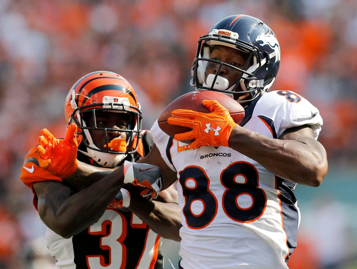 Denver Broncos wide receiver Demaryius Thomas (88) catches a pass for a touchdown ahead of Cincinnati Bengals cornerback Chris Lewis-Harris (37) in the fourth quarter of the NFL Week 3 game between the Cincinnati Bengals and the Denver Broncos at Paul Brown Stadium on Sunday, Sept. 25, 2016. The Bengals fell to 1-2 with a 29-17 loss.