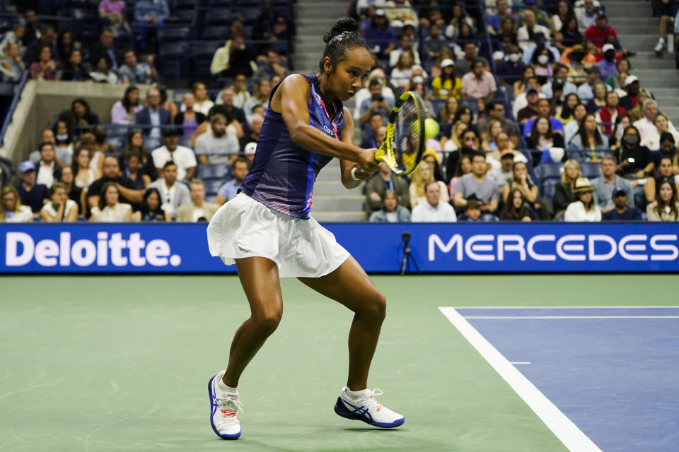 Leylah Fernandez, of Canada, returns a shot to Naomi Osaka, of Japan, during the third round of the US Open tennis championships, Friday, Sept. 3, 2021, in New York. (AP Photo/John Minchillo)