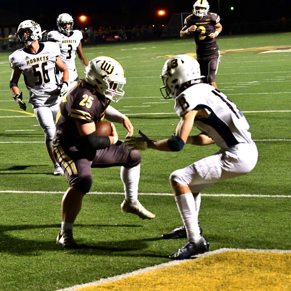 Matthew Osborne (25) hauls in a touchdown catch for Western Brown at the Monroe vs. Western Brown football game Friday, Sept. 2, 2022.