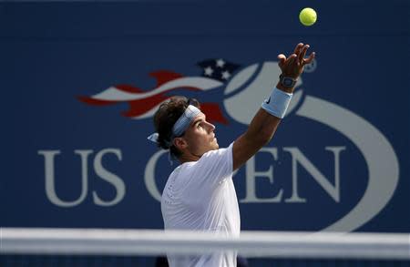 Rafael Nadal of Spain serves to Ivan Dodig of Croatia at the U.S. Open tennis championships in New York August 31, 2013. REUTERS/Ray Stubblebine