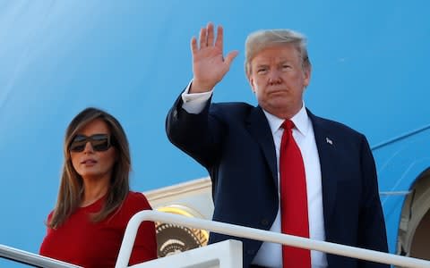 Donald and Melania Trump boarding Air Force One - Credit: Reuters