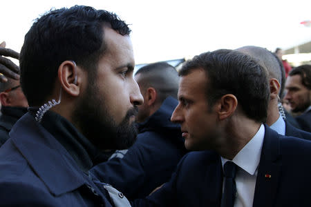 FILE PHOTO: Senior Elysee senior security officer Alexandre Benalla (L) stands next to French President Emmanuel Macron during a visit to the Paris International Agricultural Show, February 24, 2018. REUTERS/Stephane Mahe/Pool/File Photo