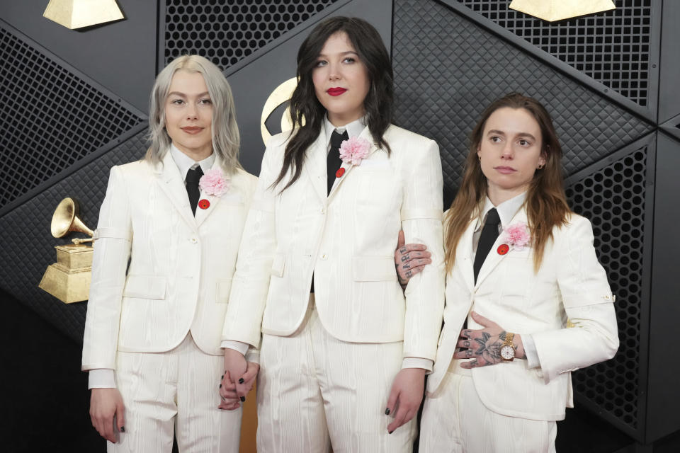 Phoebe Bridgers, from left, Lucy Dacus, and Julien Baker of boygenius arrive at the 66th annual Grammy Awards on Sunday, Feb. 4, 2024, in Los Angeles. (Photo by Jordan Strauss/Invision/AP)