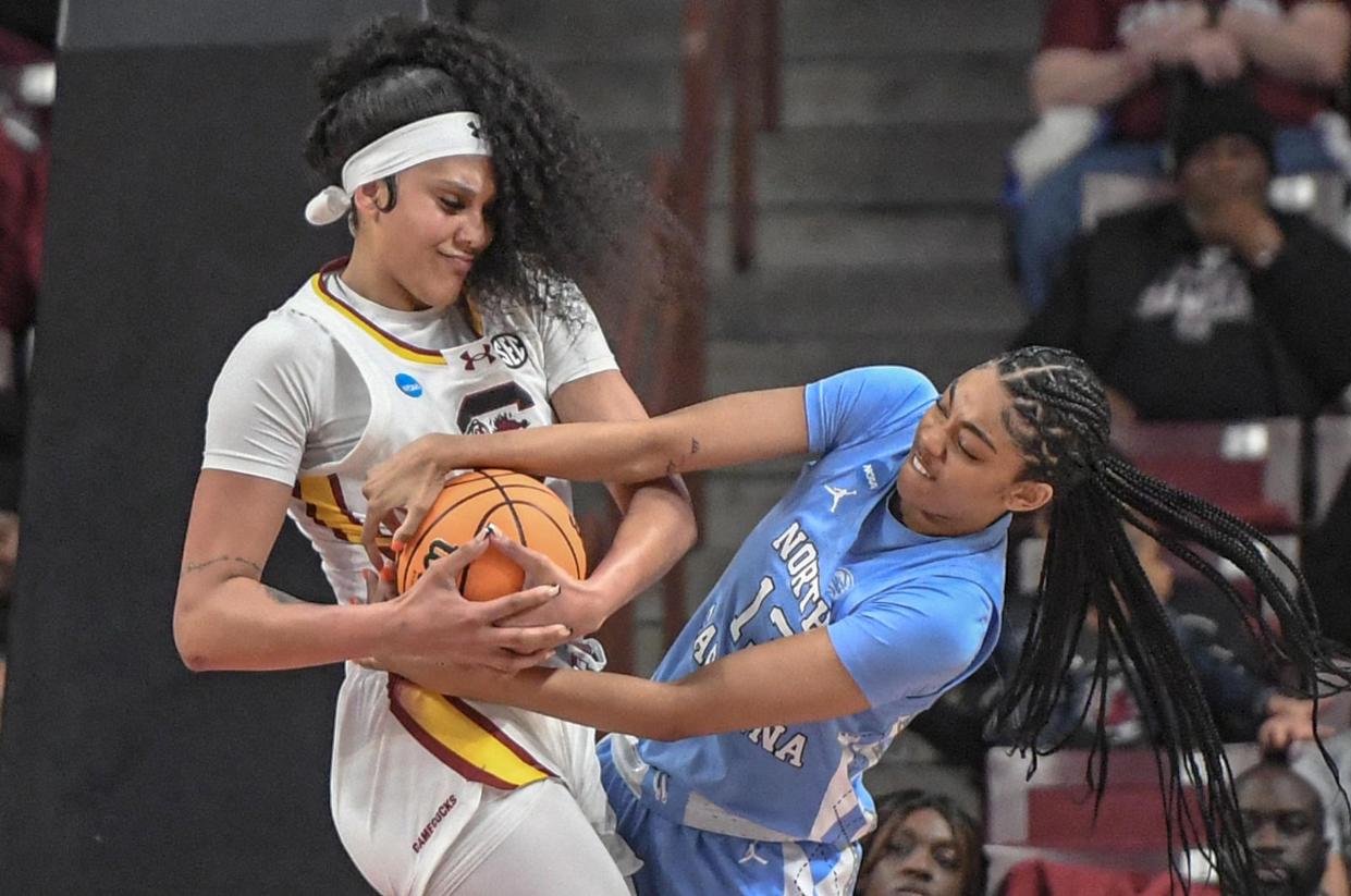 Kamilla Cardoso (10) and Teonni Key (13) battle for a rebound during South Carolina's 88-41 romp.