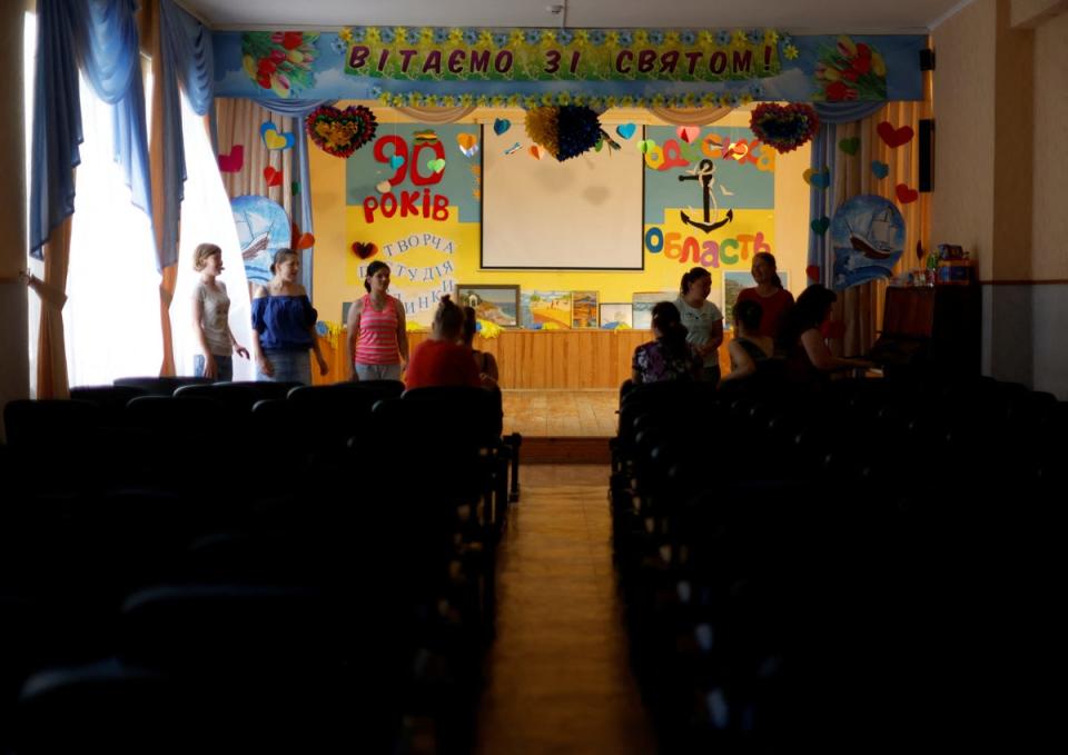 Residents take part in a music and drama lesson (Reuters)