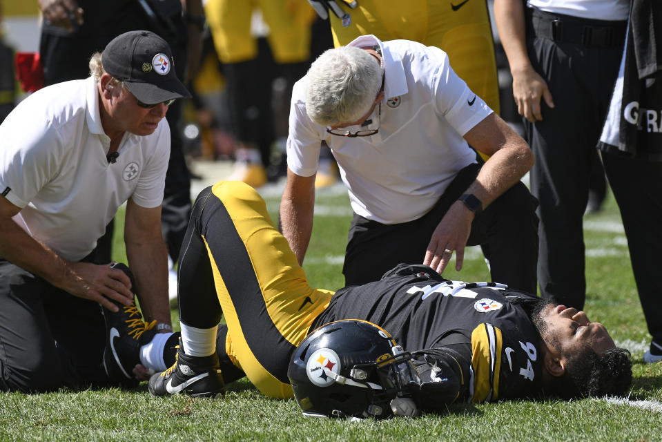 Pittsburgh Steelers defensive end Tyson Alualu (94) is tended to by a team doctor after being injured during the first half of an NFL football game against the Las Vegas Raiders in Pittsburgh, Sunday, Sept. 19, 2021. (AP Photo/Don Wright)
