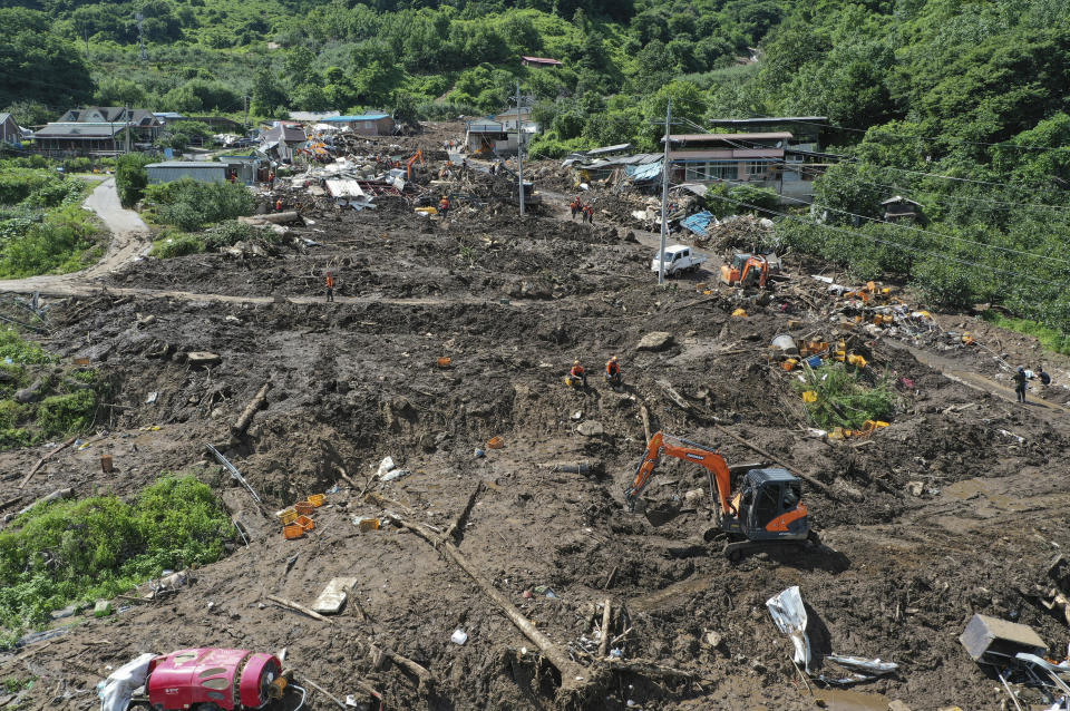 Restoration work is underway at houses collapsed after a landslide caused by heavy rain in Yecheon, South Korea, Monday, July 17, 2023. Heavy downpours lashed South Korea for a ninth day on Monday as rescue workers struggled to search for survivors in landslides, buckled homes and swamped vehicles in the most destructive storm to hit the country this year. (Kim Dong-min/Yonhap via AP)