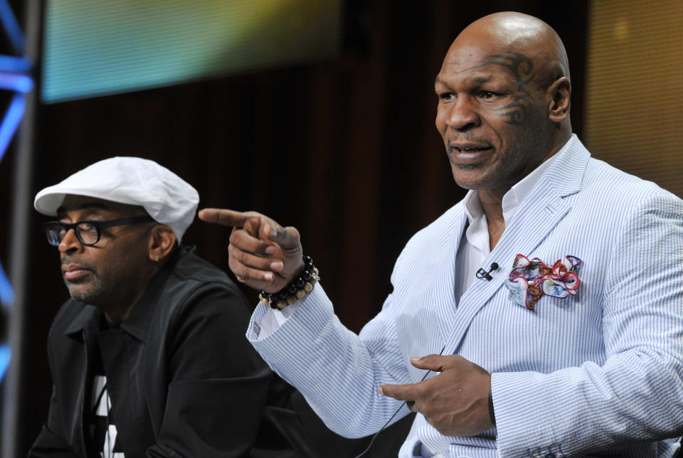 Spike Lee, left, director of "Mike Tyson: Undisputed Truth," and Mike Tyson take part in a panel discussion on the film during HBO's Summer 2013 TCA panel at the Beverly Hilton Hotel on Thursday, July 25, 2013, in Beverly Hills, Calif. (Photo by Chris Pizzello/Invision/AP)