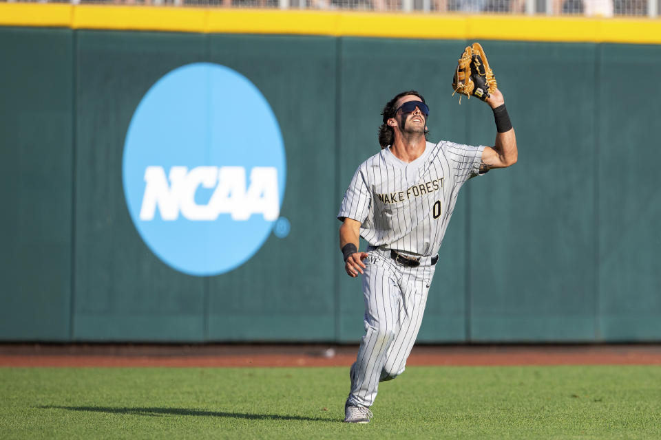 Wake Forest's Lucas Costello makes a catch against LSU during the fourth inning in a baseball game at the NCAA College World Series in Omaha, Neb., Thursday, June 22, 2023. (AP Photo/John Peterson)