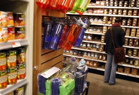 A woman shops for groceries at a Whole Foods supermarket in New York May 18, 2010. REUTERS/Shannon Stapleton