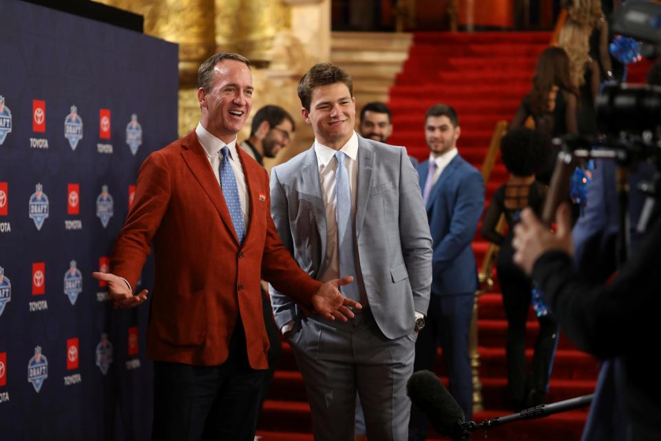 Former NFL quarterback Peyton Manning interviews NFL prospect Drake Maye, a quarterback who played at North Carolina, as he walks the red carpet for NFL draft day at the Fox Theatre in Detroit on Thursday, April 25, 2024.