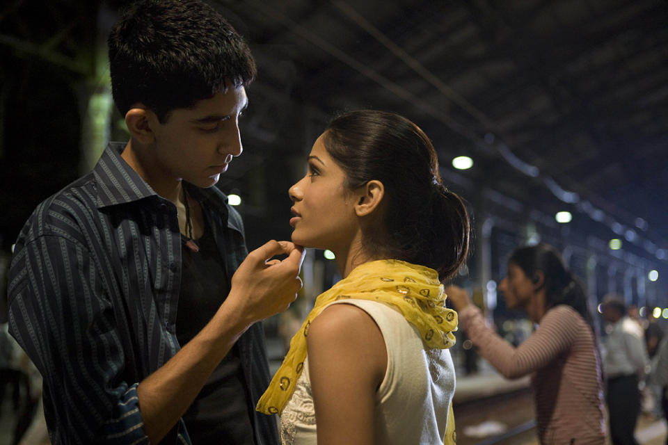 <a href="http://movies.yahoo.com/movie/slumdog-millionaire/" data-ylk="slk:SLUMDOG MILLIONAIRE;elm:context_link;itc:0;sec:content-canvas" class="link ">SLUMDOG MILLIONAIRE</a> <br>Directed by: <span>Danny Boyle</span> <br>Starring: <span>Dev Patel</span>, <span>Anil Kapoor</span>, <span>Freida Pinto</span>