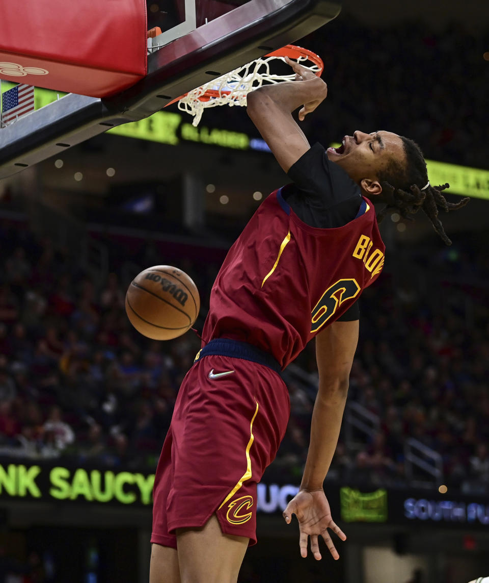 Cleveland Cavaliers center Moses Brown dunks in the second half of an NBA basketball game against the Milwaukee Bucks, Sunday, April 10, 2022, in Cleveland. The Cavaliers won 133-115. (AP Photo/David Dermer)