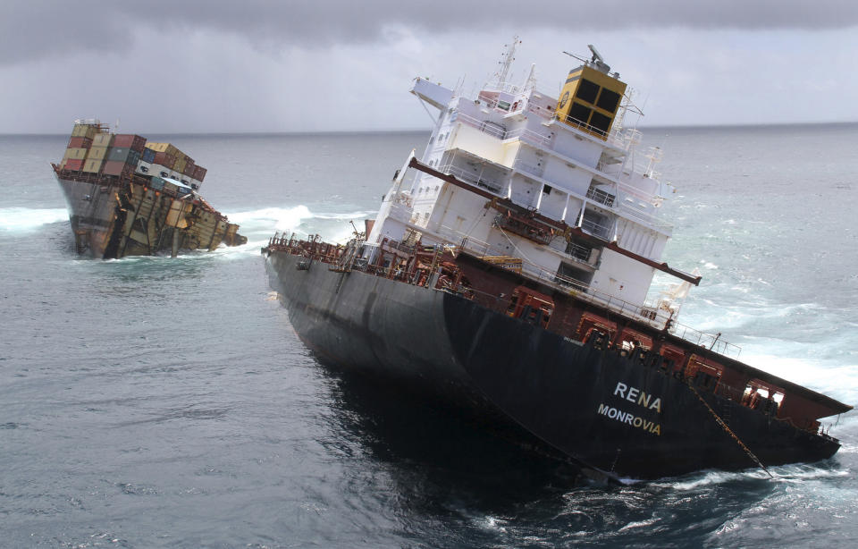 In this Jan. 9, 2012 file photo provided by Maritime New Zealand, the cargo ship Rena is split in two and sits on a reef near Tauranga, New Zealand. The captain and the navigating officer of the ship that ran aground on the reef last year pleaded guilty Wednesday, Feb. 29, 2012 to a series of charges. (AP Photo/Maritime New Zealand, File) EDITORIAL USE ONLY