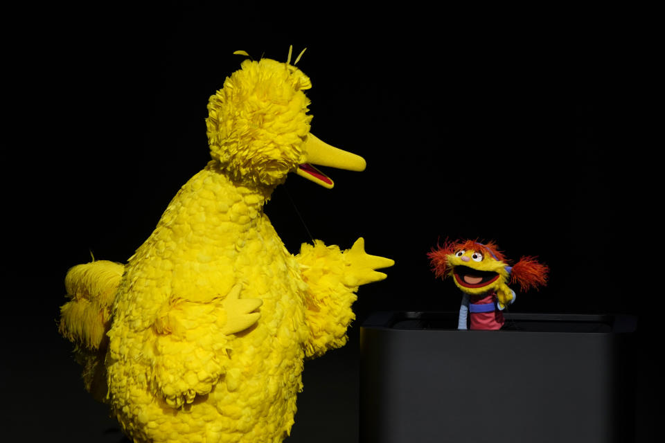 Characters from "Sesame Street" Big Bird, left, and Cody perform at the Steve Jobs Theater during an event to announce new Apple products Monday, March 25, 2019, in Cupertino, Calif. (AP Photo/Tony Avelar)