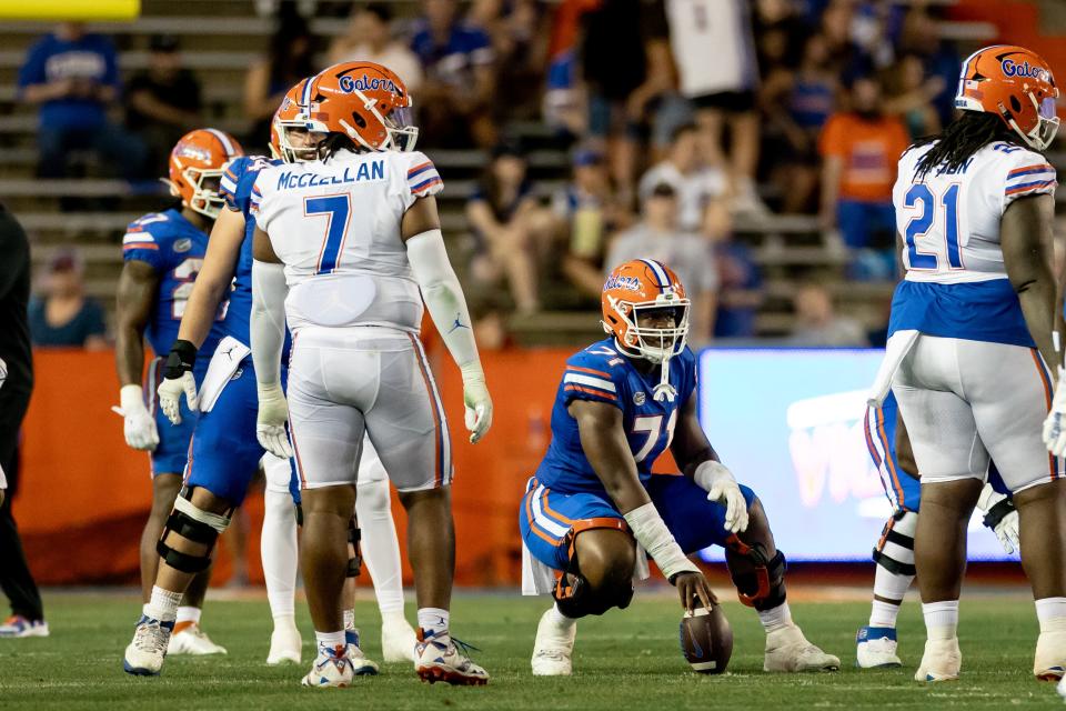 Offensive lineman Roderick Kearney (71) holds the ball before snapping during the second half of the Florida Gators' Orange and Blue Game on April 13.