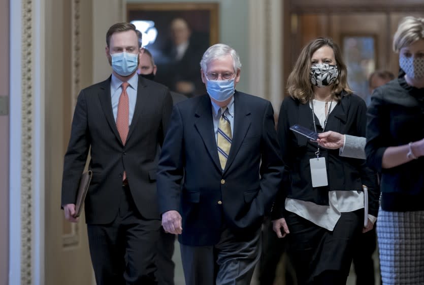 Senate Minority Leader Mitch McConnell, R-Ky., leaves the chamber after the Senate voted not guilty in the impeachment trial of former President Donald Trump on the charge of inciting the January 6 attack on the Congress by a mob of his supporters, at the Capitol in Washington, Saturday, Feb. 13, 2021. (AP Photo/J. Scott Applewhite)