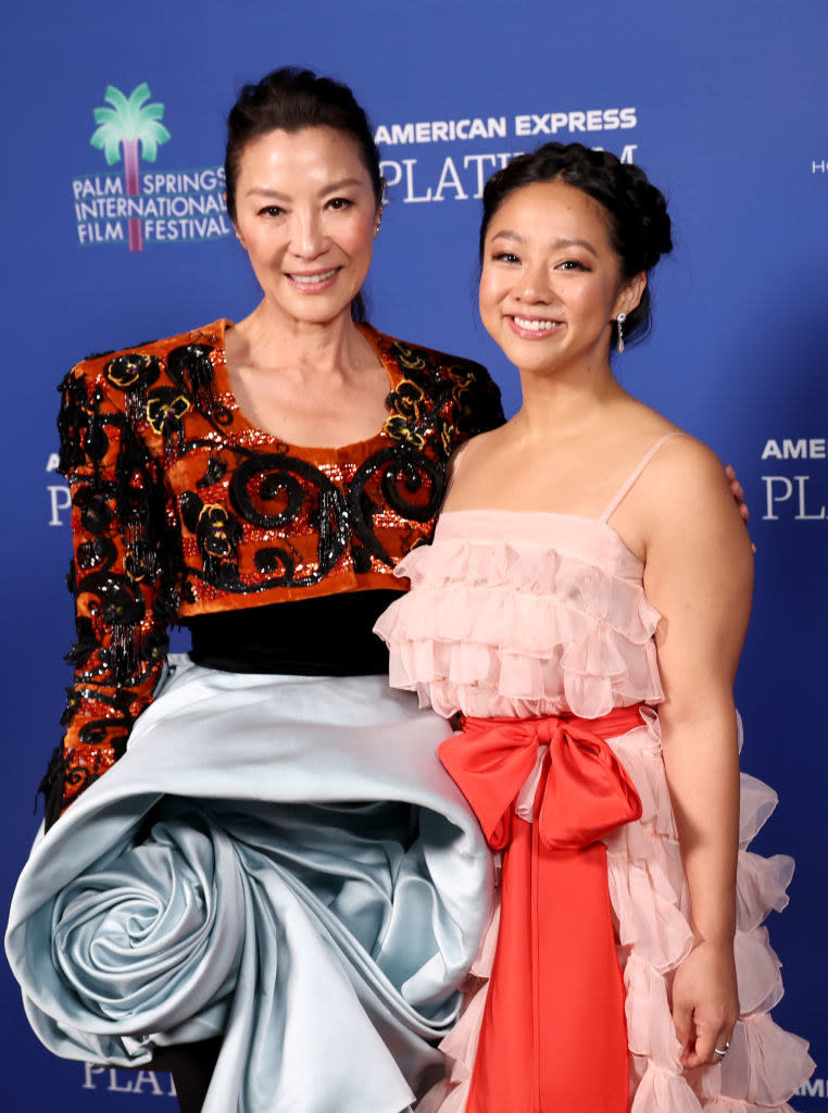 Michelle and Stephanie stand together smiling