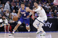 Sacramento Kings guard Bogdan Bogdanovic, left, drives to the basket against Memphis Grizzlies guard Dillon Brooks, right, during the first quarter of an NBA basketball game Thursday, Feb. 20, 2020, in Sacramento, Calif. (AP Photo/Rich Pedroncelli)