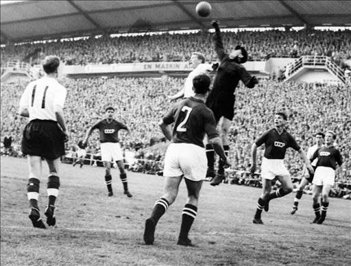 Goalkeeper Lev Yashin (black) from the Soviet Union boxes the ball away from an English player during the World Cup first round soccer match between the Soviet Union and England 08 June 1958 in Goteborg. The match ended in a 2-2 tie. AFP PHOTO/PRESSENBILD