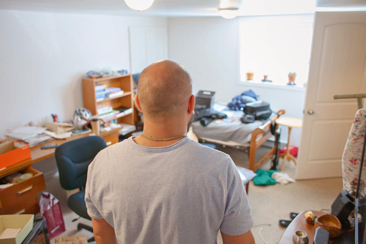 landlord walking into untidy room of renter