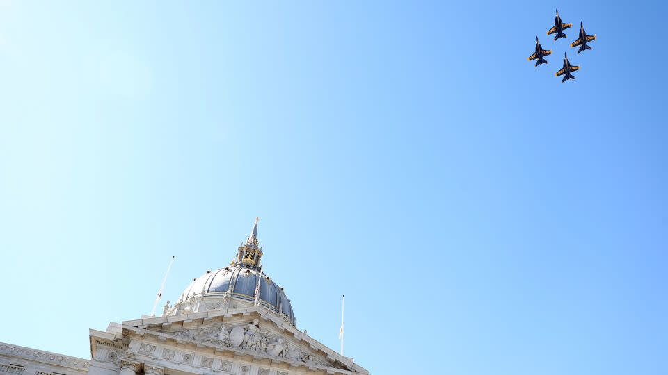 US Navy Blue Angels fly over City Hall during the memorial service. - Scott Strazzante/San Francisco Chronicle/AP