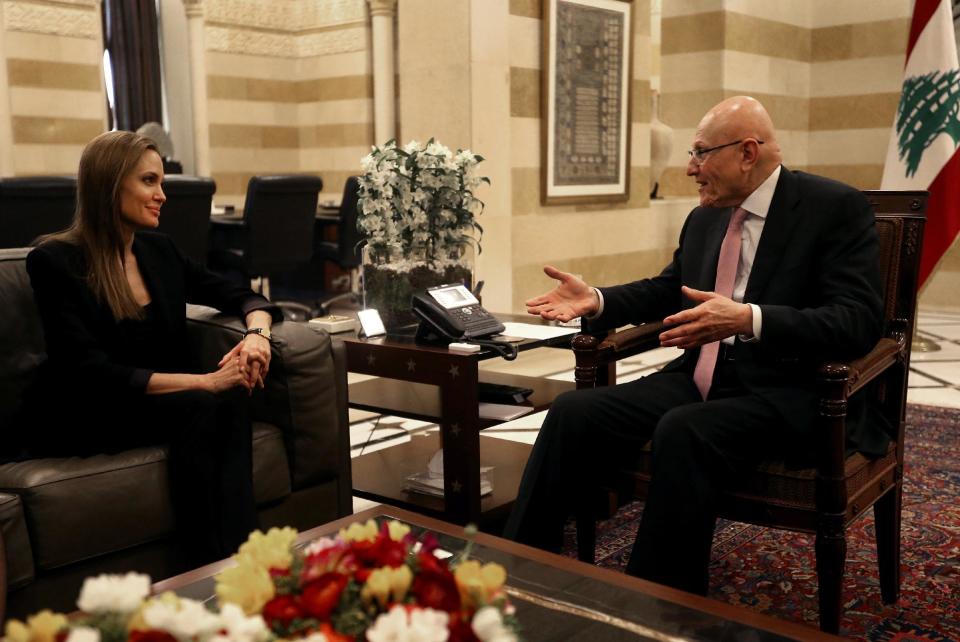 RE TRANSMITTING FOR ALTERNATE TONING - United Nations High Commissioner for Refugees special envoy Angelina Jolie, meets with Lebanese Prime Minister Tammam Salam, at the government palace, in Beirut, Lebanon, Monday Feb. 24, 2014. Actress and U.N. special envoy Angelina Jolie made a surprise visit to Lebanon to draw attention to the challenges facing thousands of Syrian refugee children and to highlight the massive displacement Syria’s three-year conflict has created, officials said Monday. The tiny Mediterranean country of Lebanon, which neighbors Syria, has absorbed nearly one million refugees, swelling the country’s population by one-fifth. (AP Photo/Hussein Malla)