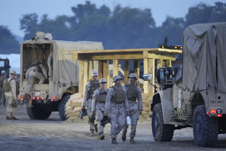 American Marines prepare for annual combat drills between the Philippine Marine Corps and U.S. Marine Corps in Capas, Tarlac province, northern Philippines, Thursday, Oct. 13, 2022. Truck-mounted launchers blasted off rockets Thursday and U.S. stealth fighter jets streaked across the northern Philippine sky in a combat drill and latest display of American firepower in a region where Washington has tried to deter what it warns as China's growing aggression. (AP Photo/Aaron Favila)