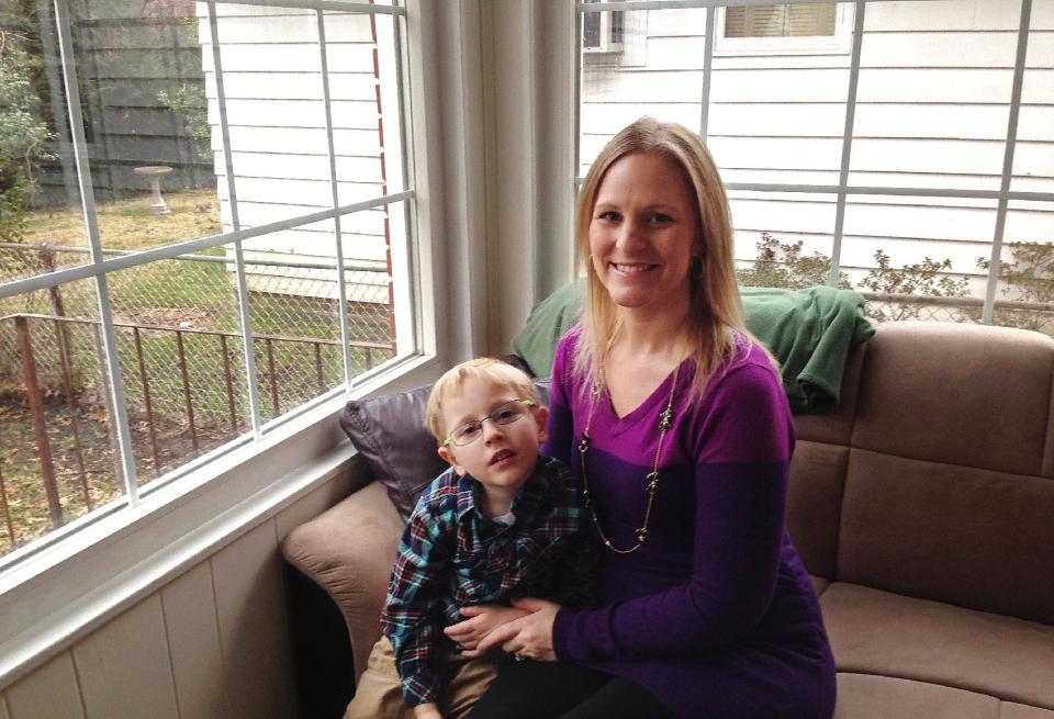 Sarah Bergstrom poses for a photo with her son Blake, 4, Friday, Jan. 17, 2014, in her home in Charleston, W.Va. The 29-year-old nurse who is 4 months pregnant with her second child was devastated when she learned after a ban on tap water was lifted days after a chemical leak that health officials urged pregnant women not to drink tap water until the chemical is entirely undetectable. (AP Photo/John Raby)