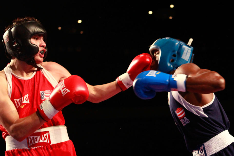 Jose Ramirez, 19, (red) lands a punch on Raynell Williams (blue) during the 2012 U.S. Men's Boxing Olympic Team Trials at the Mobile Civic Center on August 5, 2011 in Mobile, Alabama. Ramirez defeated Williams in a decision. (Kevin C. Cox/Getty Images)