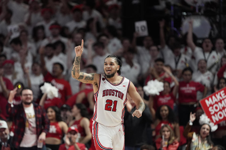 Houston's Emanuel Sharp (21) celebrates during the second half of an NCAA college basketball game against Iowa State Monday, Feb. 19, 2024, in Houston. Houston won 73-65. (AP Photo/David J. Phillip)