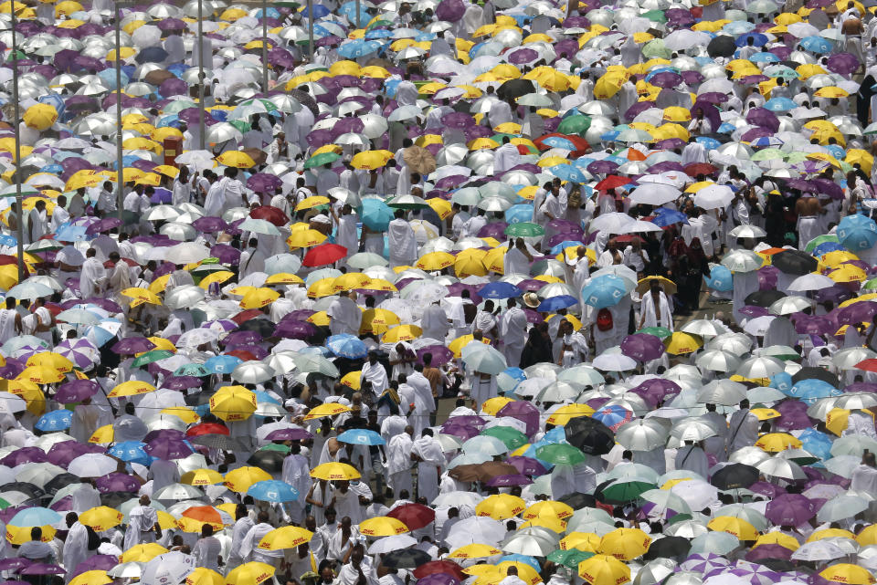 Hundreds of thousands of Muslim pilgrims listen to a sermon outside Namira Mosque in Arafat during the annual hajj pilgrimage, near the holy city of Mecca, Saudi Arabia, Saturday, Aug. 10, 2019. More than 2 million pilgrims were gathered to perform initial rites of the hajj, an Islamic pilgrimage that takes the faithful along a path traversed by the Prophet Muhammad some 1,400 years ago. (AP Photo/Amr Nabil)