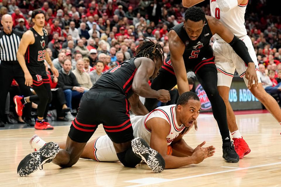 Ohio State Buckeyes forward Zed Key (23) calls timeout after falling on a loose ball between Rutgers Scarlet Knights center Clifford Omoruyi (11) and forward Aundre Hyatt (5)