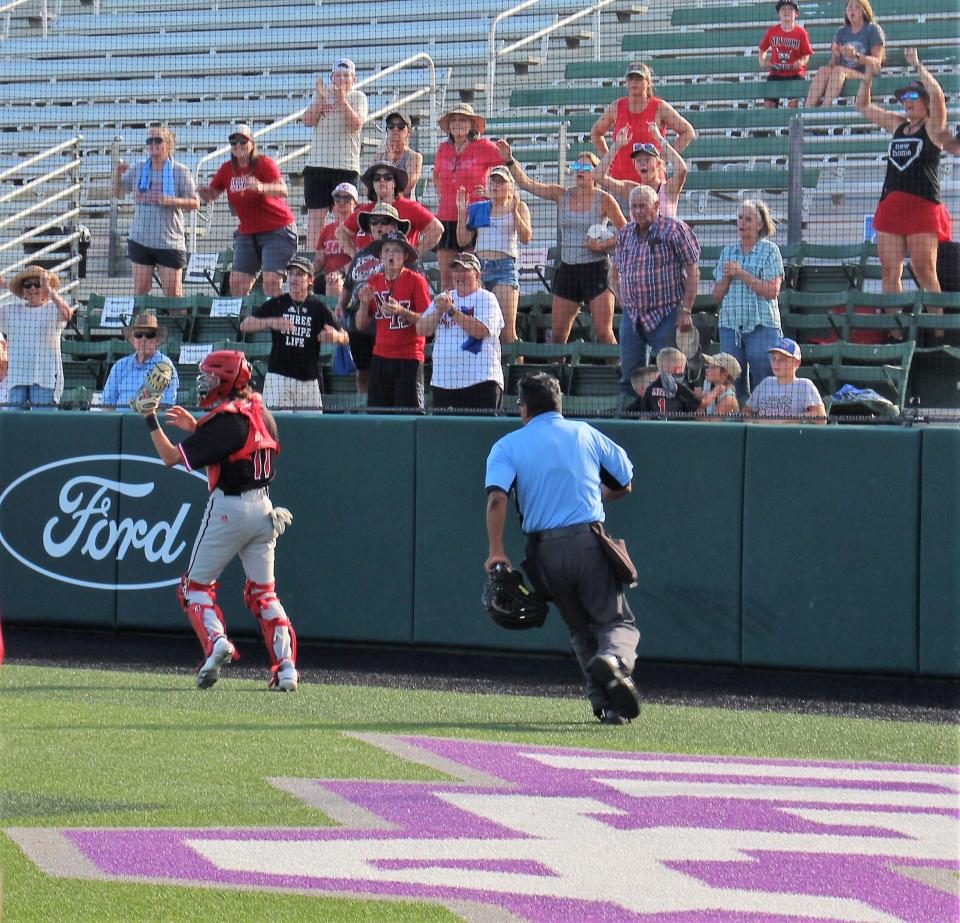 New Home catcher Ryan Bundy makes the grab near the fence and Leopards fans cheer the final out of Saturday's Game 3, won by New Home 13-12 over Anson at ACU's Crutcher Scott Field. The win sends New Home to the Region I-2A final.