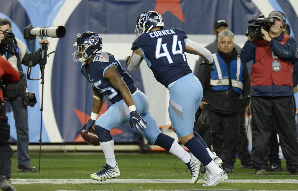 Tennessee Titans inside linebacker Jayon Brown (55) scores a touchdown on a 22-yard pass interception against the Indianapolis Colts in the first half of an NFL football game Sunday, Dec. 30, 2018, in Nashville, Tenn. At right is outside linebacker Kamalei Correa (44). (AP Photo/Mark Zaleski)
