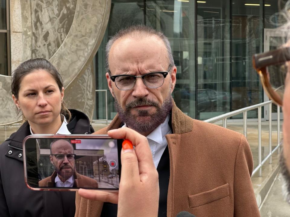 Skibicki lawyer Leonard Tailleur, standing next to defence lawyer Alyssa Munce, spoke to reporters outside the courthouse following the judge's decision on Friday to keep the trial scheduled to be heard by a jury.