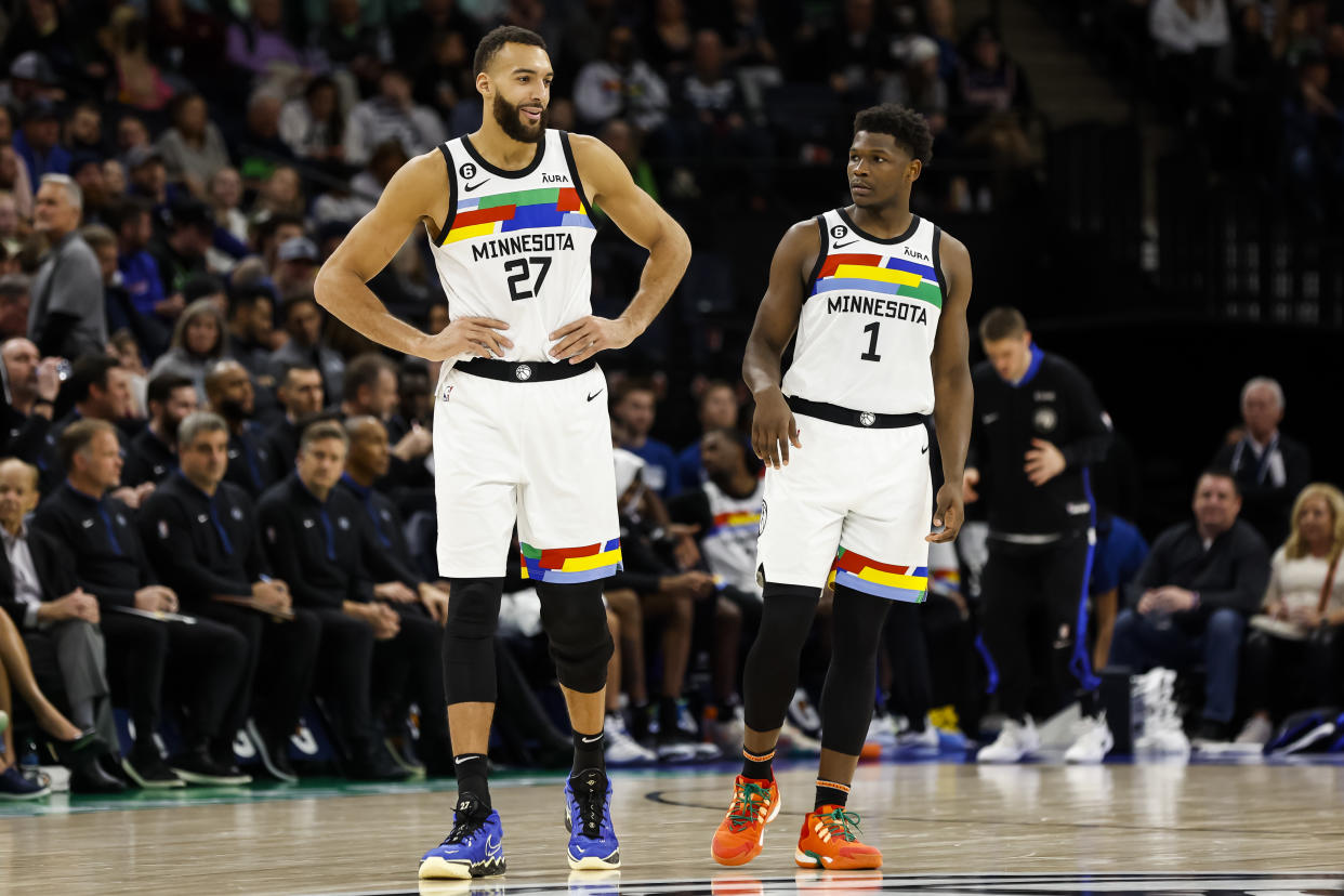 MINNEAPOLIS, MN - JANUARY 13: Rudy Gobert #27 and Anthony Edwards #1 of the Minnesota Timberwolves interact in the fourth quarter of the game against the Phoenix Suns at Target Center on January 13, 2022 in Minneapolis, Minnesota. The Timberwolves defeated the Suns 121-116. NOTE TO USER: User expressly acknowledges and agrees that, by downloading and or using this Photograph, user is consenting to the terms and conditions of the Getty Images License Agreement. (Photo by David Berding/Getty Images)