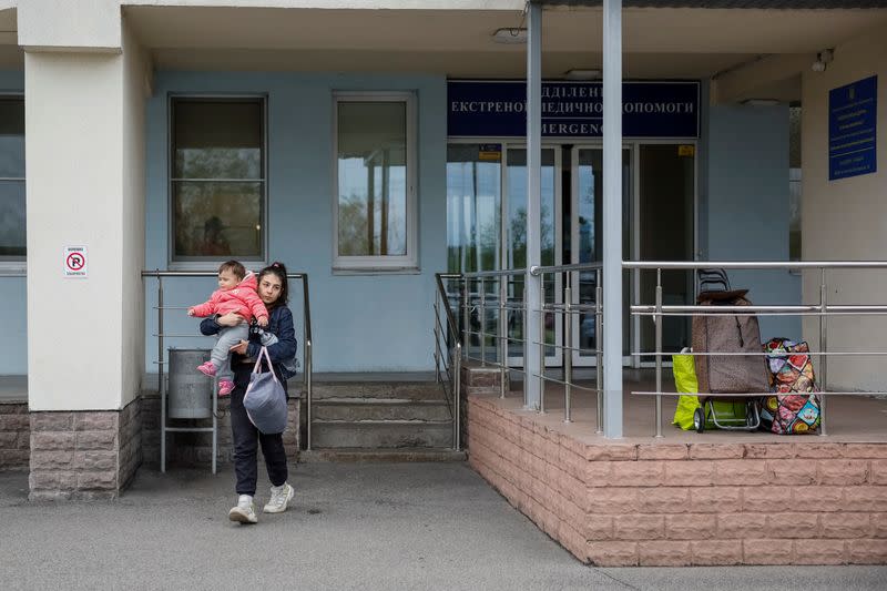 People evacuate hospital after authorities declare possible danger of Russian strike, in Kyiv