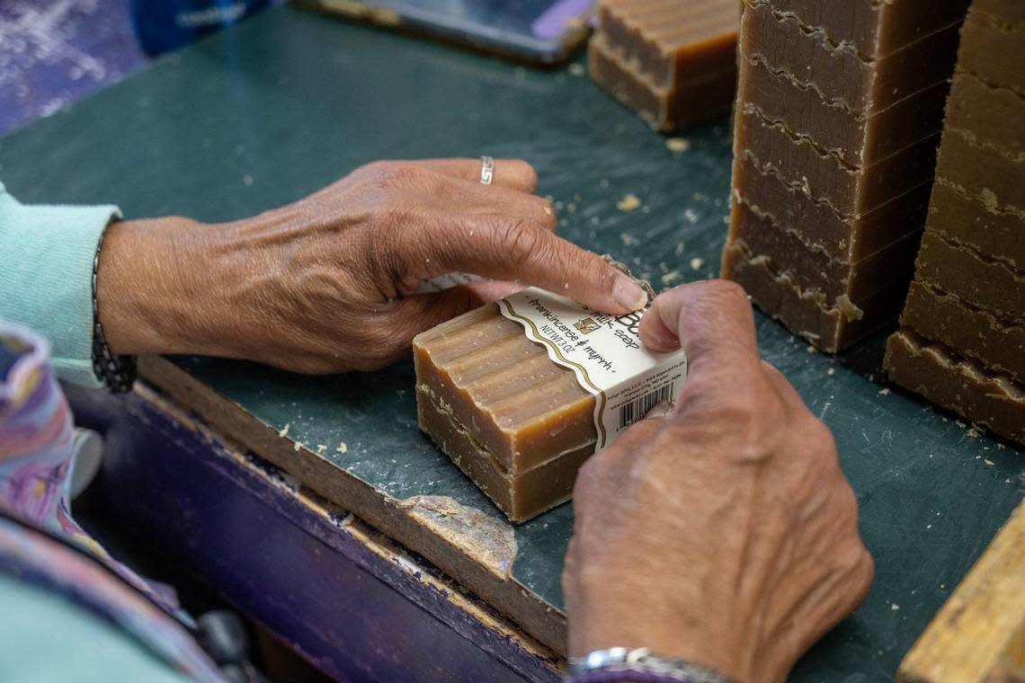 Berma Webb labels bars of frankincense and myrrh Zum Bar soap.