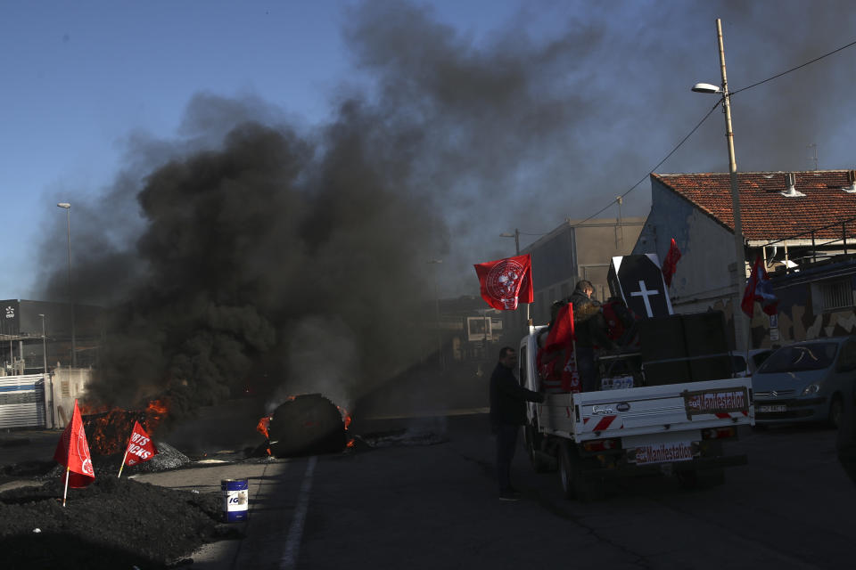 Protesters prepare to leave the Mediterranean port city of Marseille, southern France, after tensions, Thursday, Dec.12, 2019. Unions have flatly rejected fresh proposals by the government of pro-business President Emmanuel Macron to stagger the roll-out of a plan that would require France's youngest workers - people born after 1974 - to stay on the job until the age of 64 to get full pensions instead of age 62. (AP Photo/Daniel Cole)