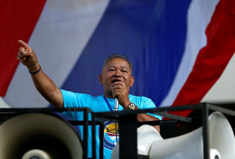 Man talks at a protest outside the Agriculture Ministry in Bangkok