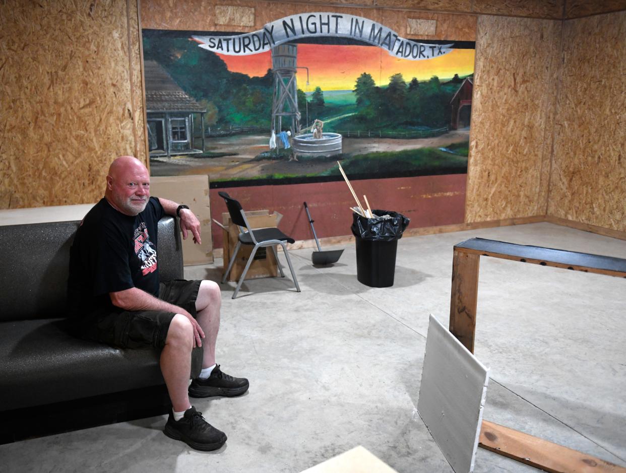 Pat Smith sits in front of the old Billie Dean's Cafe mural in his updated diner a year after the Matador tornado, Tuesday, June 16, 2024, in Matador, Texas.