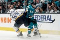 May 19, 2019; San Jose, CA, USA; St. Louis Blues defenseman Colton Parayko (55) and San Jose Sharks center Melker Karlsson (68) fight for control of the puck during the third period in Game 5 of the Western Conference Final of the 2019 Stanley Cup Playoffs at SAP Center at San Jose. Mandatory Credit: Stan Szeto-USA TODAY Sports