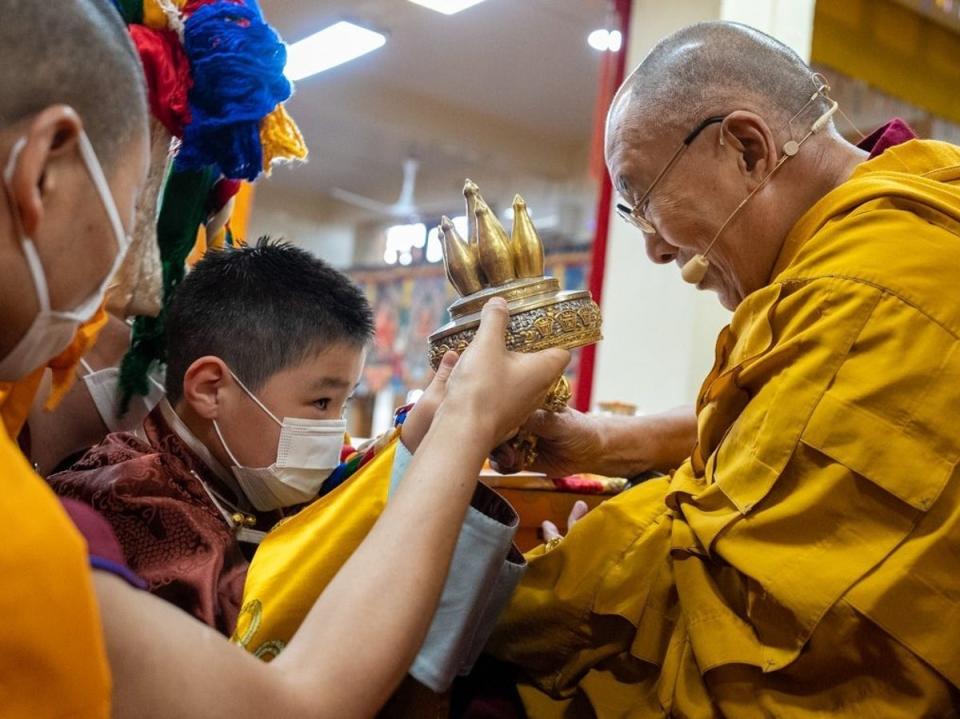 An eight-year-old boy is recognised as the tenth Khalkha Jetsun Dhampa Rinpoche by the Dalai Lama in a ceremony in Dharamshala in Himachal Pradesh, India, on 8 March 2023  (Tenzin Choejor/The Office of His Holiness the Dalai Lama)